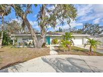 Well-kept single-Gathering home with mature trees and a spacious driveway at 1409 2Nd E Ave, Bradenton, FL 34208