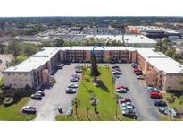 Spacious apartment complex featuring ample parking and well-maintained landscaping in a convenient location at 4218 Heron Way # 311, Bradenton, FL 34205