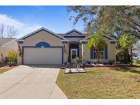 Charming home featuring a well-manicured lawn, two car garage and a decorative color scheme at 4630 56Th E Dr, Bradenton, FL 34203