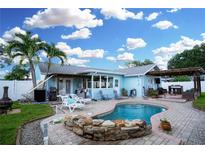 A backyard pool and covered patio area, ideal for entertaining and outdoor relaxation at 6513 14Th W Ave, Bradenton, FL 34209