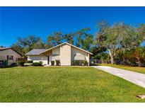 Charming one-story home with a well-manicured lawn at 1327 Abscott St, Port Charlotte, FL 33952