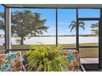 Relaxing screened lanai overlooking a tranquil lake at 25225 Rampart Blvd # 1901, Punta Gorda, FL 33983
