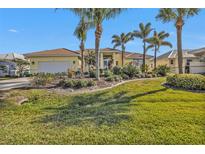 Beautiful one-story home with a landscaped yard and palm trees at 4315 Cape Haze Dr, Placida, FL 33946