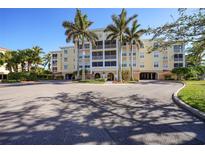 Attractive condo building with palm trees and ample parking at 255 W End Dr # 2412, Punta Gorda, FL 33950