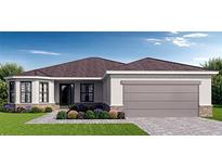 One-story home with brown roof, light-colored siding, and a two-car garage at 349 Gold Tree, Punta Gorda, FL 33955