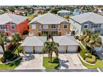 Aerial view of a waterfront community with a focus on a charming yellow building at 2002 Bal Harbor Blvd # 1822, Punta Gorda, FL 33950