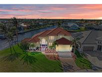 Luxury waterfront home with private dock and stunning sunset views at 1245 Whippoorwill Ct, Punta Gorda, FL 33950