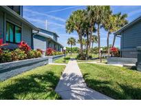 Pathway meanders through a tropical garden setting at 1839 Settlers Dr # B-6, Nokomis, FL 34275