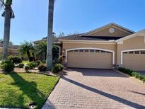 Beautiful home with two-car garage and landscaped front yard at 4530 Turnberry Cir, North Port, FL 34288