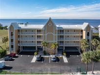 Three-story waterfront building with parking and water views at 101 N Marion Ct # 114, Punta Gorda, FL 33950