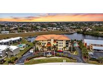 Aerial view of waterfront community with pool and boat slips at 1340 Rock Dove Ct # 135, Punta Gorda, FL 33950