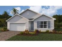 Single-story home with white siding, gray shutters, and a two-car garage at 9578 Turtle Grass Cir, Punta Gorda, FL 33950