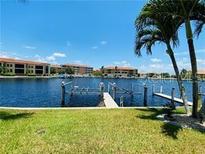 Stunning waterfront view with private docks and lush landscaping at 3311 Wood Thrush Dr # 111, Punta Gorda, FL 33950