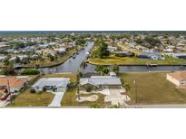 Aerial view showcasing home, canal, and neighborhood at 160 Salem Nw Ave, Port Charlotte, FL 33952