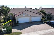 Two-car garage, double-wide driveway, and nicely landscaped front yard at 317 Monaco Dr # 7, Punta Gorda, FL 33950