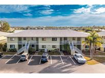 Aerial view of a condo building with parking and water access at 25225 Rampart Blvd # 1701, Punta Gorda, FL 33983