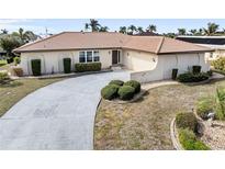 Single-story home with tile roof and landscaped yard at 625 Via Tunis, Punta Gorda, FL 33950