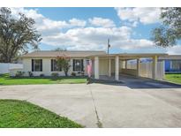 Updated single story home with carport and landscaped lawn at 1219 Ansin St, Punta Gorda, FL 33950