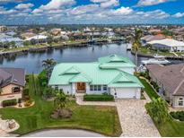 Luxury waterfront home with green roof and canal views at 3412 Nighthawk Ct, Punta Gorda, FL 33950