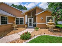 Charming home featuring a well-maintained yard and beautiful water fountain features at 4267 Adelaide Ave, North Port, FL 34288