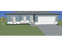 One-story home with blue siding, white trim, and a paved driveway at 3733 Basket St, North Port, FL 34288