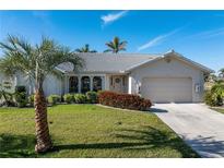 Beautiful home with a landscaped yard and attached two-car garage at 3749 Bordeaux Dr, Punta Gorda, FL 33950