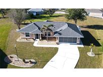 Single-story home with a two-car garage and landscaped yard at 16129 Coruna Ct, Punta Gorda, FL 33955