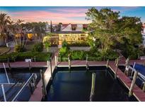 Aerial view of waterfront home with private docks and boat slips at 25188 Marion Ave # 12, Punta Gorda, FL 33950