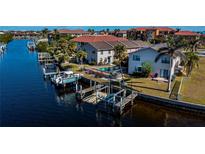 Aerial view of waterfront property with private boat dock and pool at 3335 Purple Martin Dr # 6, Punta Gorda, FL 33950