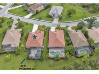 House in a residential community with swimming pools and green spaces at 13147 Preserve Ct, Port Charlotte, FL 33953