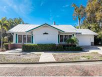 Charming one-story home with a metal roof and brick accents at 227 Harvey St, Punta Gorda, FL 33950