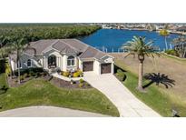 Luxury waterfront home with expansive canal views and private dock at 1454 Surfbird Ct, Punta Gorda, FL 33950