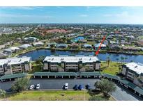 Aerial view of waterfront condo community, showcasing building and boat slips at 601 Shreve St # 46A, Punta Gorda, FL 33950