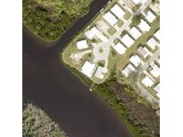 Aerial view of a waterfront community in an idyllic riverside location at 735 Blackburn Blvd, North Port, FL 34287