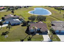 Aerial view of single-Gathering home with pool and heart-shaped lake nearby at 7352 Parkinsonia, Punta Gorda, FL 33955