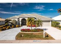 Beautiful single-story home with landscaped yard and driveway at 1014 Francesca Ct, Punta Gorda, FL 33950