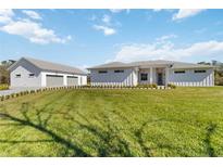 Beautiful home featuring a spacious lawn, two-car garage, and neutral color palette at 2154 Azure Rd, North Port, FL 34286
