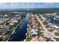 Aerial view of waterfront home with private pool and canal access at 2807 Sancho Panza Ct, Punta Gorda, FL 33950