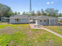 Charming single-story home with a walkway and a well-maintained lawn at 425 Fireball Ct, Punta Gorda, FL 33950