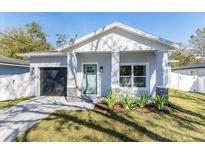 Charming craftsman style home with a teal door and stone accents at 706 W Madison St, Plant City, FL 33563