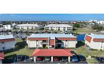 Aerial view of waterfront condo community with boat slips and parking at 311 Garvin St # 207B, Punta Gorda, FL 33950