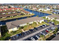 Aerial view of waterfront condo community with boat slips and parking at 4000 Bal Harbor Blvd # 225, Punta Gorda, FL 33950