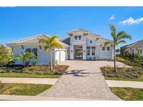 Two-story home with a two car garage at 500 Blue Shell Loop, Sarasota, FL 34240