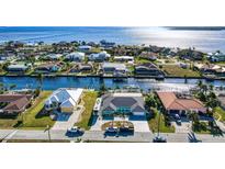 Expansive aerial view of waterfront homes with direct canal access and stunning water views at 121 Sinclair Se St, Port Charlotte, FL 33952