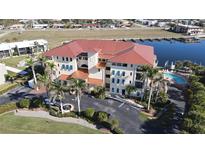 Stunning waterfront condo with a pool, lush landscaping, and convenient parking at 1340 Rock Dove Ct # 143, Punta Gorda, FL 33950