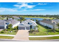 Stunning home with three-car garage, beautiful landscaping and an inviting entrance at 25186 Keygrass Ct, Punta Gorda, FL 33955