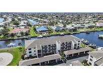 Waterfront condo complex with boat docks, covered parking, and beautiful canal views at 367 Coldeway Dr # H10, Punta Gorda, FL 33950