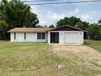 Charming single story home with attached one car garage and large front yard at 432 Olivia Rd, Venice, FL 34293