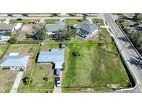 Aerial view of property including neighboring structures and property line highlighted in yellow at 3120 Wisteria Pl, Punta Gorda, FL 33950