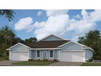Charming single-story home with a two-car garage and neatly landscaped front yard under a blue sky at 2136 Royal Tern Cir, Punta Gorda, FL 33983